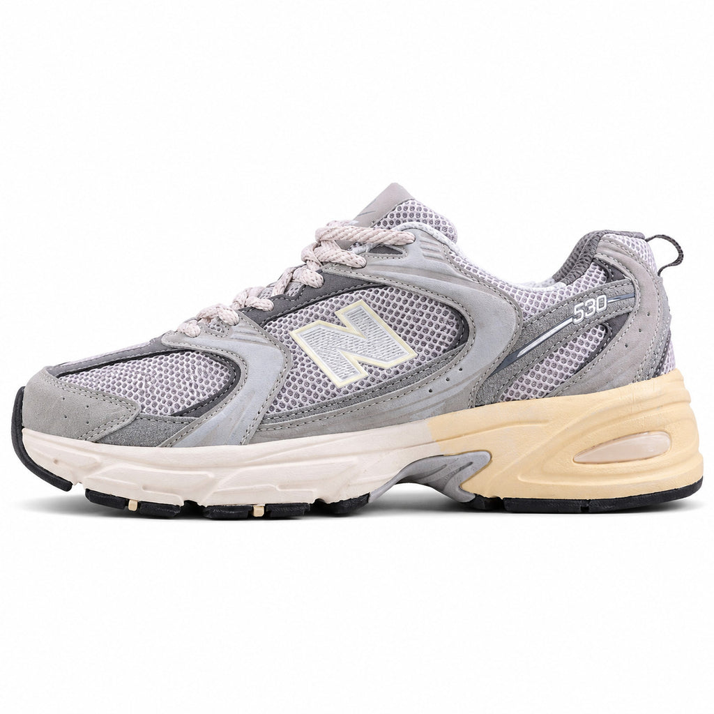 New Balance 530 gris crema ante vista lateral izquierda